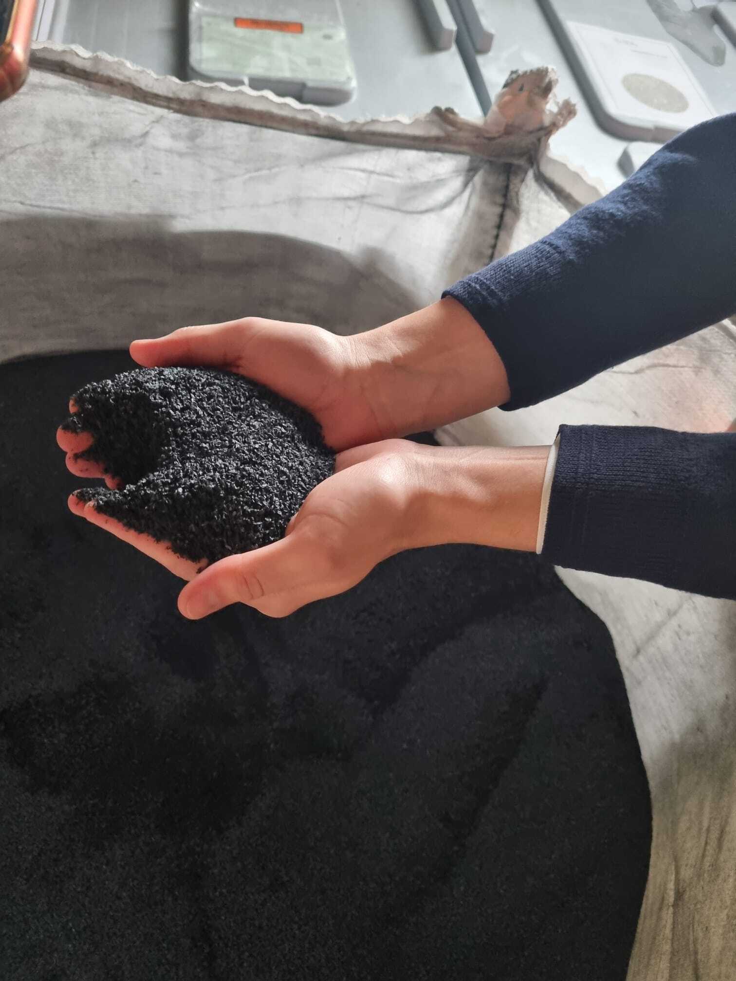 Leo holding biochar